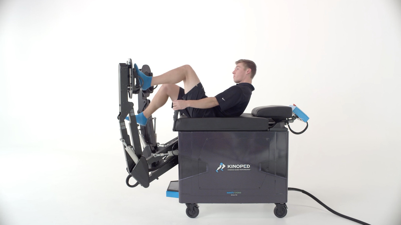 A person using the Kinoped lower-extremity exercise robot